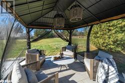 View of patio / terrace featuring an outdoor hangout area and a gazebo - 