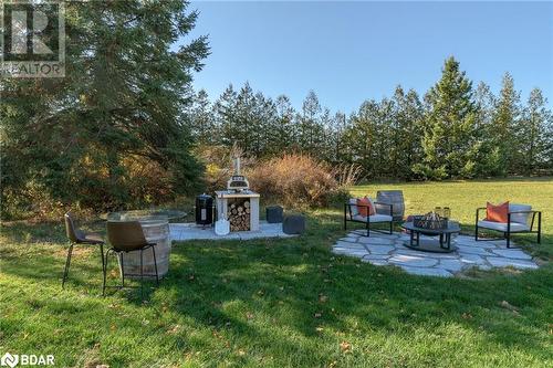 View of yard featuring a fire pit and a patio - 18133 Loyalist Parkway, Prince Edward County, ON - Outdoor With Backyard