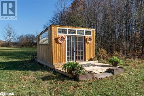 View of outdoor structure featuring a lawn - 18133 Loyalist Parkway, Prince Edward County, ON - Outdoor