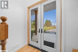 Entryway with french doors and light hardwood / wood-style flooring - 