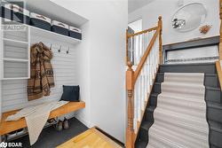 Mudroom featuring hardwood / wood-style flooring - 