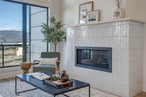 102-1100 Antler Drive, Penticton, BC - Indoor Photo Showing Living Room With Fireplace