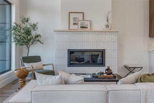 102-1100 Antler Drive, Penticton, BC - Indoor Photo Showing Living Room With Fireplace