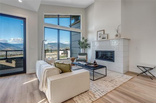 102-1100 Antler Drive, Penticton, BC - Indoor Photo Showing Living Room With Fireplace