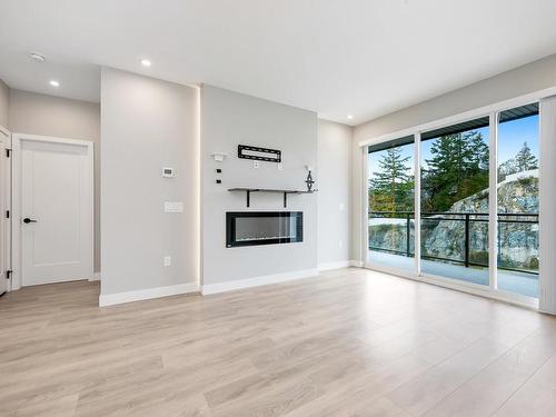 312-967 Whirlaway Cres, Langford, BC - Indoor Photo Showing Living Room With Fireplace