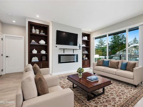 312-967 Whirlaway Cres, Langford, BC - Indoor Photo Showing Living Room With Fireplace