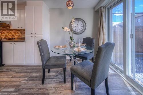 Dining room with hardwood / wood-style floors - 83 Bridlewreath Street, Kitchener, ON - Indoor Photo Showing Dining Room