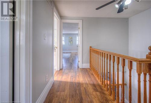 Hallway with a textured ceiling and dark hardwood / wood-style flooring - 83 Bridlewreath Street, Kitchener, ON - Indoor Photo Showing Other Room