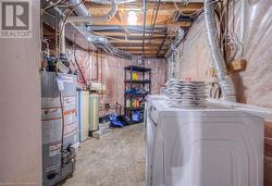 Basement with gas water heater and independent washer and dryer - 