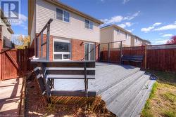 Back of house with a wooden deck - 