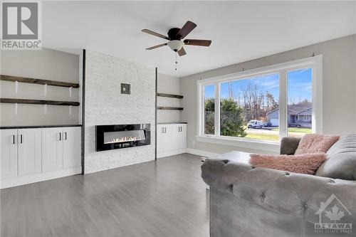 Family room - 4715 Kelso Street, Prescott, ON - Indoor Photo Showing Living Room With Fireplace