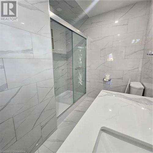 Bathroom with walk in shower, toilet, and tile walls - 115 Cranston Avenue, Cambridge, ON - Indoor Photo Showing Bathroom