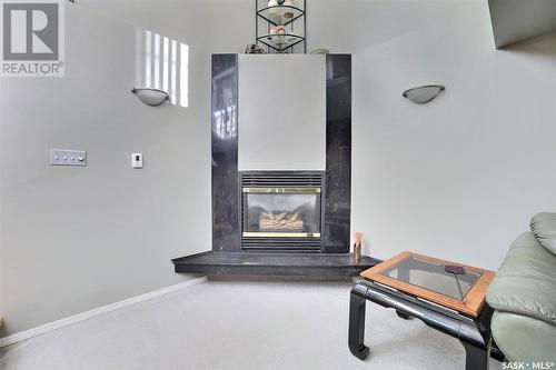 18 Park Bay, Emerald Park, SK - Indoor Photo Showing Other Room With Fireplace