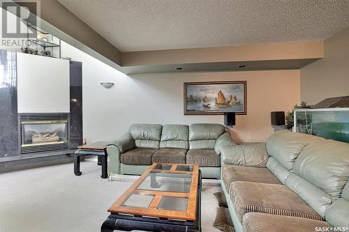 18 Park Bay, Emerald Park, SK - Indoor Photo Showing Living Room With Fireplace