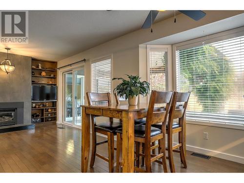 30 Lambert Place, Coldstream, BC - Indoor Photo Showing Dining Room With Fireplace