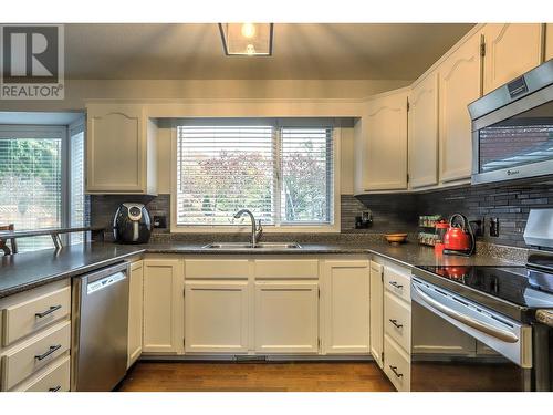 30 Lambert Place, Coldstream, BC - Indoor Photo Showing Kitchen With Double Sink