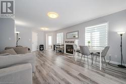 Living room featuring a wealth of natural light and light hardwood / wood-style floors - 