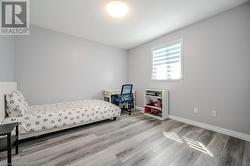 Bedroom featuring light hardwood / wood-style floors - 