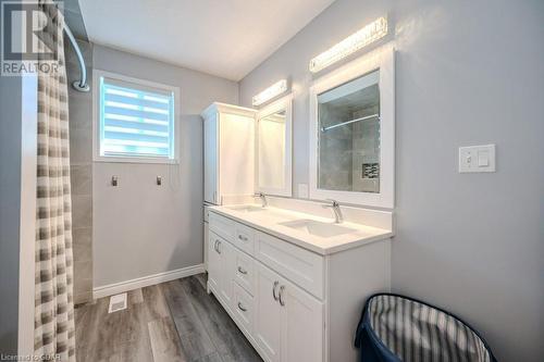 Bathroom with walk in shower, vanity, and hardwood / wood-style flooring - 192 Severn Drive, Guelph, ON - Indoor Photo Showing Bathroom