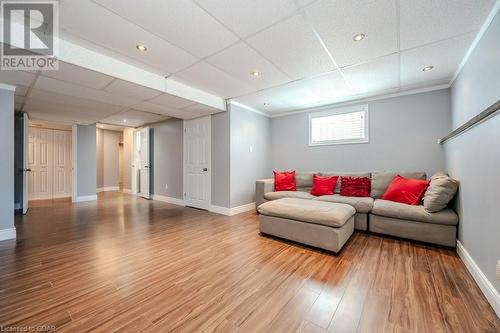 Living room featuring hardwood / wood-style flooring, a paneled ceiling, and ornamental molding - 192 Severn Drive, Guelph, ON - Indoor