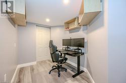 Home office with light wood-type flooring - 