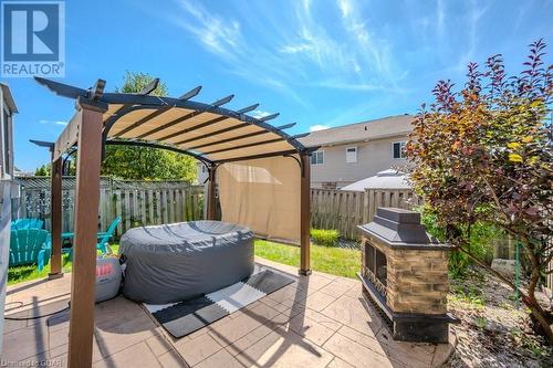 View of patio / terrace with an outdoor stone fireplace and a pergola - 192 Severn Drive, Guelph, ON - Outdoor With Deck Patio Veranda With Exterior