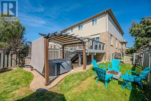 Back of property featuring an outdoor fire pit, a pergola, a deck, a patio, and a yard - 192 Severn Drive, Guelph, ON - Outdoor