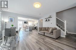 Living room with light wood-type flooring - 