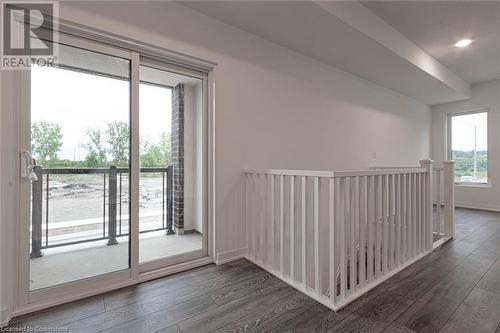 Unfurnished room featuring dark wood-type flooring - 1095 Cooke Boulevard Unit# 42, Burlington, ON - Indoor Photo Showing Other Room