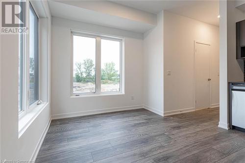 Unfurnished room with dark hardwood / wood-style flooring - 1095 Cooke Boulevard Unit# 42, Burlington, ON - Indoor