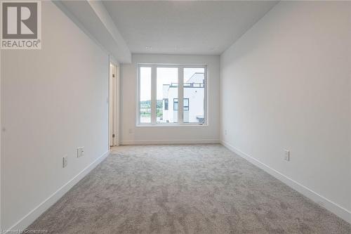 View of carpeted empty room - 1095 Cooke Boulevard Unit# 42, Burlington, ON - Indoor Photo Showing Other Room