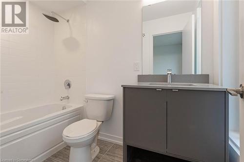 Full bathroom featuring vanity, tiled shower / bath combo, and toilet - 1095 Cooke Boulevard Unit# 42, Burlington, ON - Indoor Photo Showing Bathroom