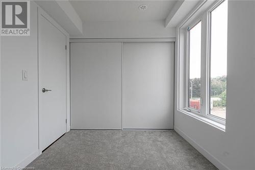 Unfurnished bedroom featuring a closet and light carpet - 1095 Cooke Boulevard Unit# 42, Burlington, ON - Indoor Photo Showing Other Room