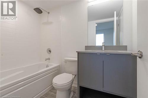 Full bathroom featuring vanity, toilet, wood-type flooring, and tiled shower / bath - 1095 Cooke Boulevard Unit# 42, Burlington, ON - Indoor Photo Showing Bathroom