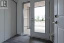 Doorway to outside featuring dark wood-type flooring and plenty of natural light - 1095 Cooke Boulevard Unit# 42, Burlington, ON  - Indoor Photo Showing Other Room 