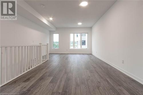 Empty room with dark hardwood / wood-style flooring - 1095 Cooke Boulevard Unit# 42, Burlington, ON - Indoor Photo Showing Other Room