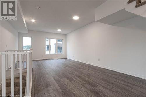 Empty room with dark wood-type flooring - 1095 Cooke Boulevard Unit# 42, Burlington, ON - Indoor Photo Showing Other Room