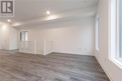 Empty room featuring dark hardwood / wood-style flooring - 1095 Cooke Boulevard Unit# 42, Burlington, ON - Indoor Photo Showing Other Room