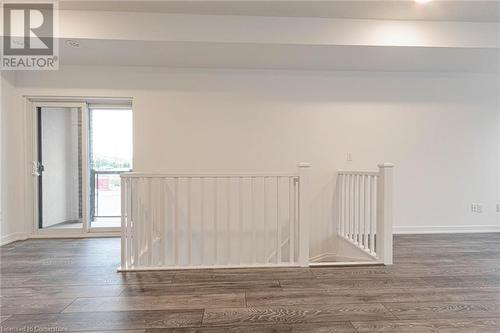 Spare room with dark hardwood / wood-style flooring - 1095 Cooke Boulevard Unit# 42, Burlington, ON - Indoor Photo Showing Other Room