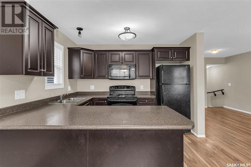 562 150 Langlois Way, Saskatoon, SK - Indoor Photo Showing Kitchen With Double Sink