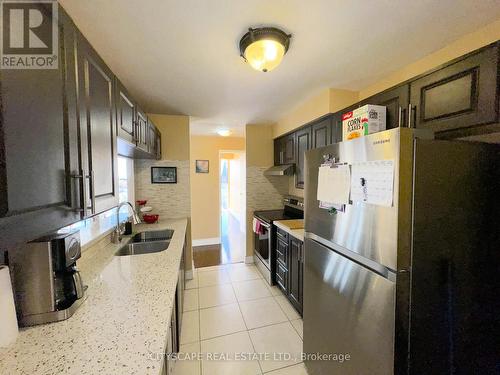 1108 - 25 Trailwood Drive, Mississauga, ON - Indoor Photo Showing Kitchen With Double Sink