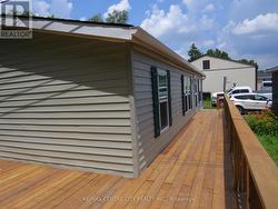 Deck on side and rear of unit - 