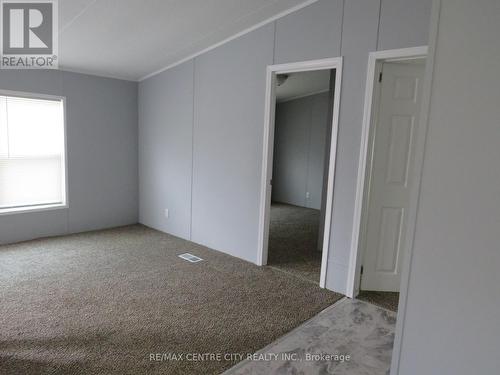 Living room with doors to 2 bedrooms - 128 - 198 Springbank Drive, London, ON - Indoor Photo Showing Other Room