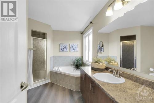 ensuite bath with separate shower and bath - 3590 Cambrian Road, Ottawa, ON - Indoor Photo Showing Bathroom