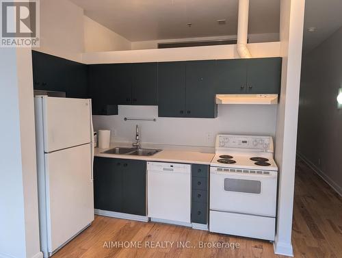 604 - 700 King Street W, Toronto, ON - Indoor Photo Showing Kitchen With Double Sink