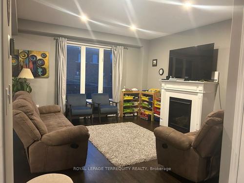 26 Moses Cres, Clarington, ON - Indoor Photo Showing Living Room With Fireplace