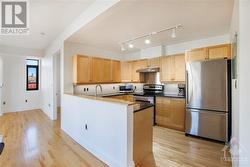 Kitchen features granite counters, stainless steel appliances, undermounted lighting - 