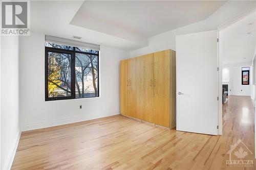 2nd bedroom with 2 armoire closets and hardwood floors - 364 Cooper Street Unit#403, Ottawa, ON - Indoor Photo Showing Other Room