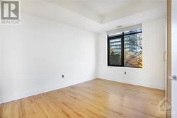 2nd bedroom with 2 armoire closets and hardwood floors - 