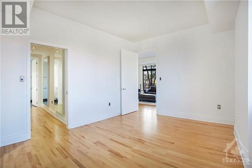 Primary bedroom with hardwood floors - 364 Cooper Street Unit#403, Ottawa, ON - Indoor Photo Showing Other Room